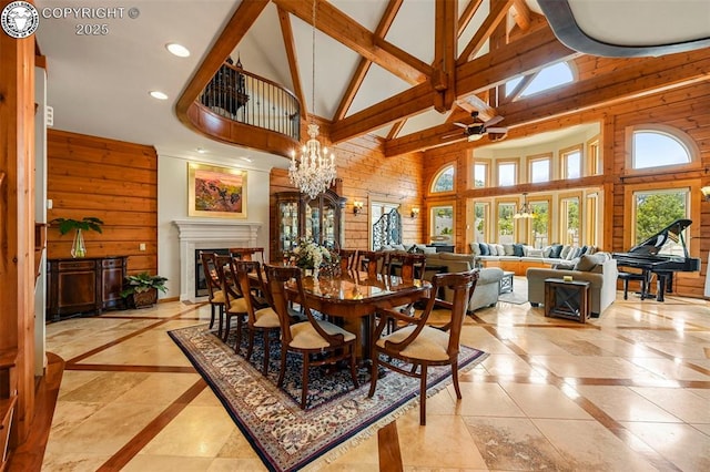 324 Elk View Ct, Canon City, CO 81212 - dining area featuring recessed lighting, wood walls, beamed ceiling, high vaulted ceiling, and ceiling fan with notable chandelier