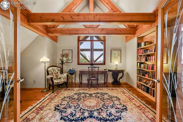 324 Elk View Ct, Canon City, CO 81212 - living area featuring wood finished floors, lofted ceiling with beams, baseboards, and built in features