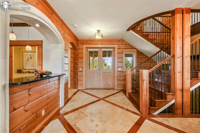 324 Elk View Ct, Canon City, CO 81212 - entryway featuring arched walkways, vaulted ceiling, and stairway