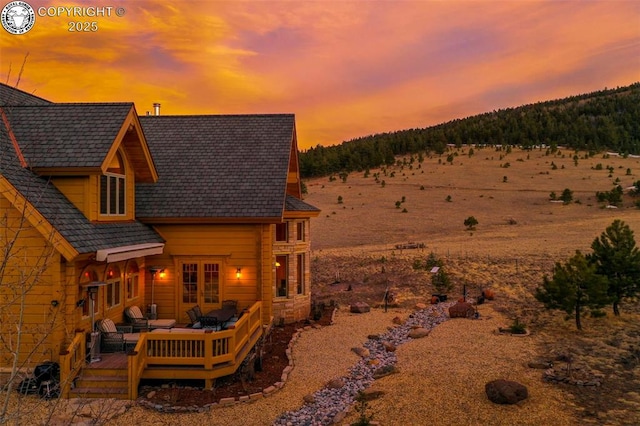 324 Elk View Ct, Canon City, CO 81212 - back of house at dusk with a wooden deck