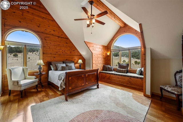 324 Elk View Ct, Canon City, CO 81212 - bedroom with ceiling fan, wood walls, light wood finished floors, and beamed ceiling