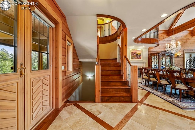 324 Elk View Ct, Canon City, CO 81212 - staircase featuring wooden walls, recessed lighting, and a notable chandelier