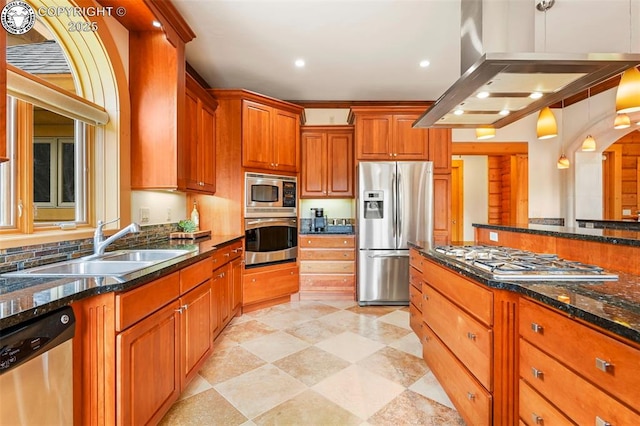 324 Elk View Ct, Canon City, CO 81212 - kitchen featuring dark stone counters, brown cabinetry, ventilation hood, appliances with stainless steel finishes, and a sink