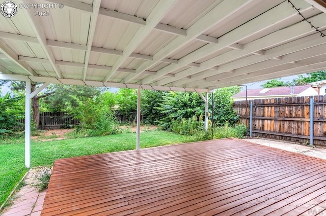 wooden deck featuring a yard