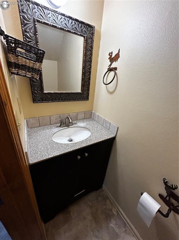 9 Granada Ct Unit 5, Westcliffe, CO 81252 - bathroom with vanity and baseboards