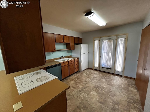 9 Granada Ct Unit 5, Westcliffe, CO 81252 - kitchen with white appliances, a sink, stone finish floors, baseboards, and brown cabinets