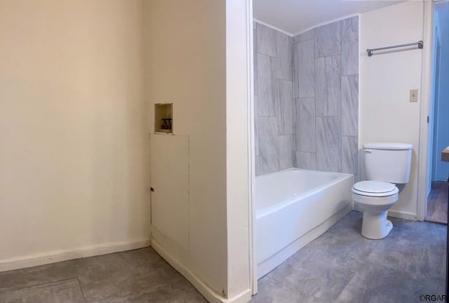 bathroom featuring shower / washtub combination and toilet