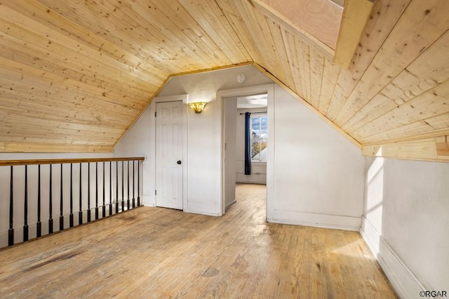 bonus room featuring lofted ceiling, wood ceiling, and hardwood / wood-style flooring