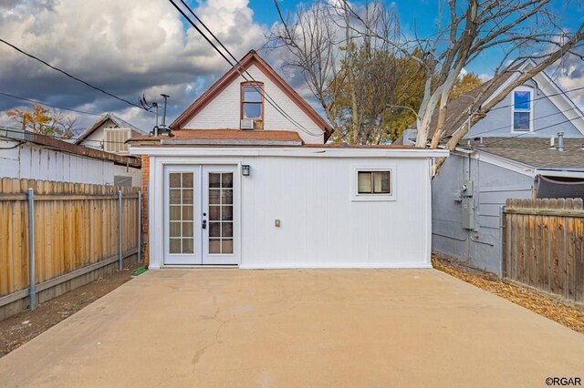 back of house featuring a patio and french doors