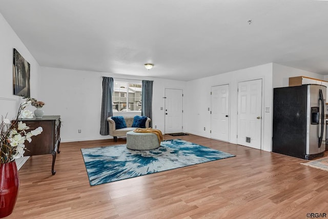 living area with light hardwood / wood-style floors