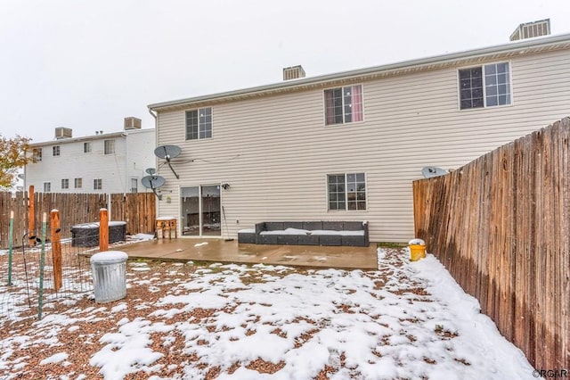 snow covered property featuring central air condition unit