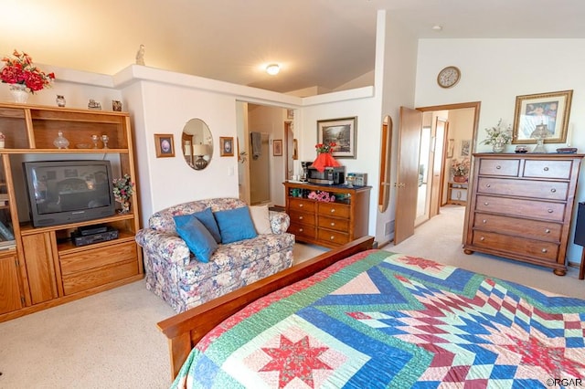 bedroom featuring lofted ceiling and light colored carpet