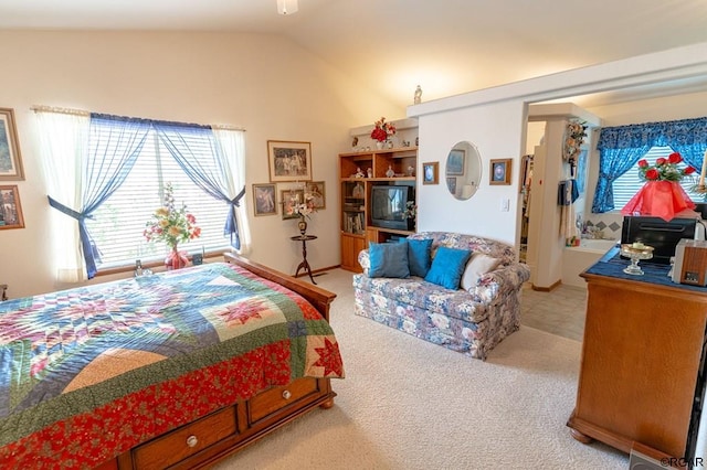 carpeted bedroom featuring lofted ceiling