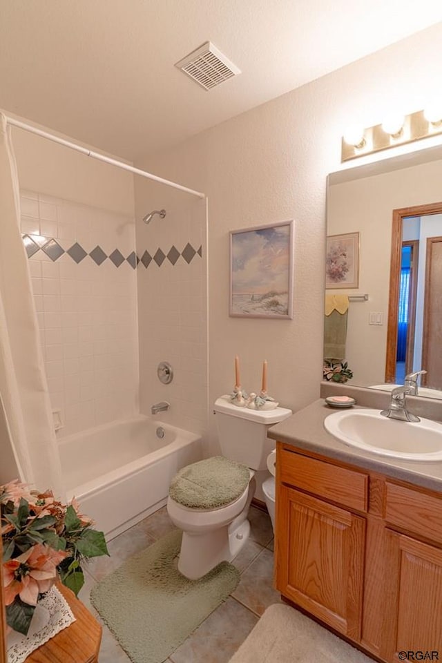 full bathroom with shower / bath combination with curtain, tile patterned floors, toilet, and vanity