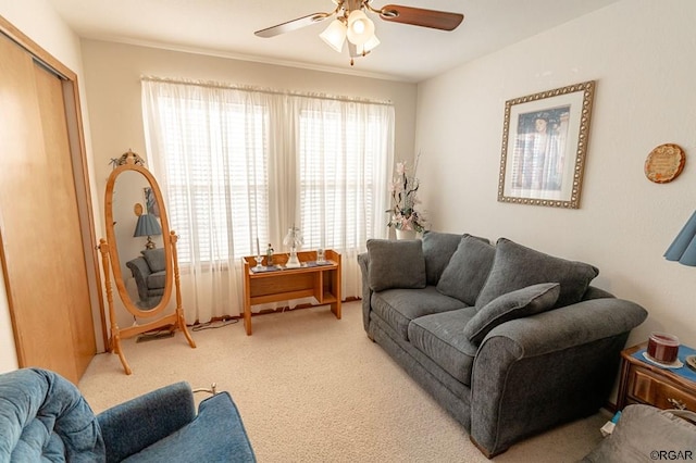 carpeted living room with ceiling fan