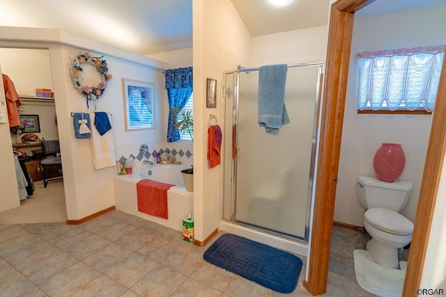 bathroom with tile patterned flooring, plenty of natural light, independent shower and bath, and toilet