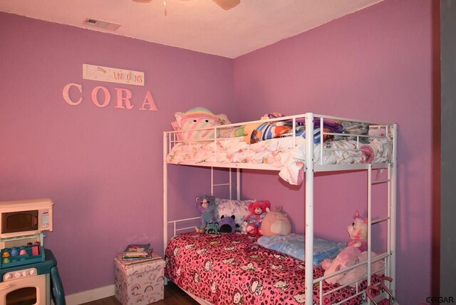 bedroom with hardwood / wood-style flooring and ceiling fan