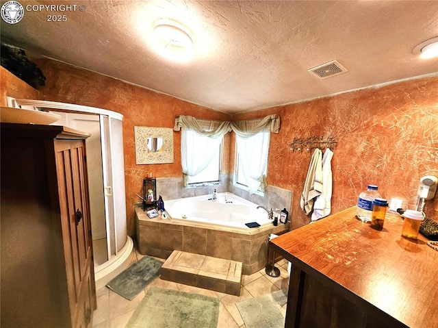 bathroom featuring a whirlpool tub, a textured ceiling, a shower stall, vaulted ceiling, and tile patterned floors