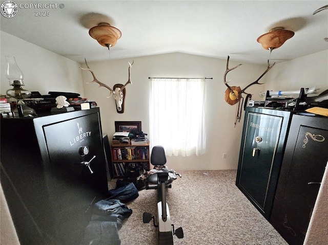 home office with carpet floors and vaulted ceiling