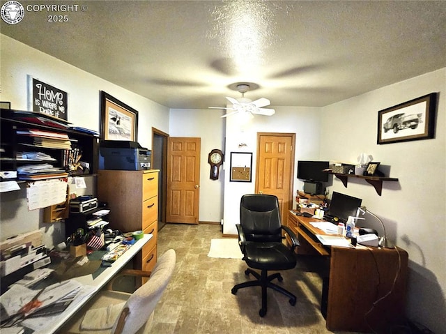 office with ceiling fan and a textured ceiling