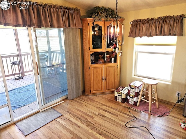 dining space featuring light wood-type flooring