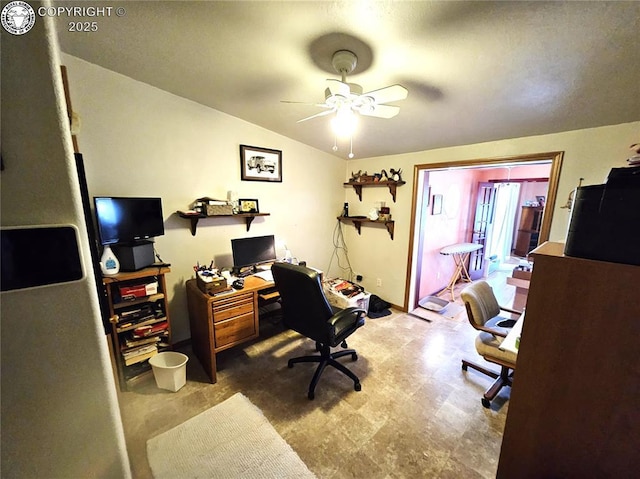 office with a ceiling fan and tile patterned floors
