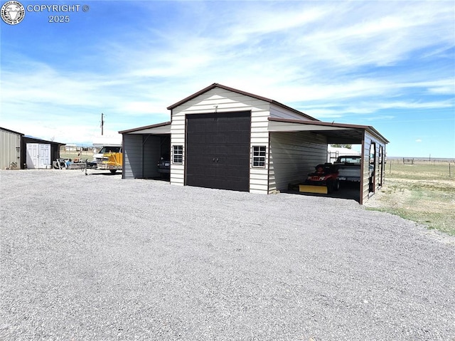 view of outbuilding with an outdoor structure and gravel driveway