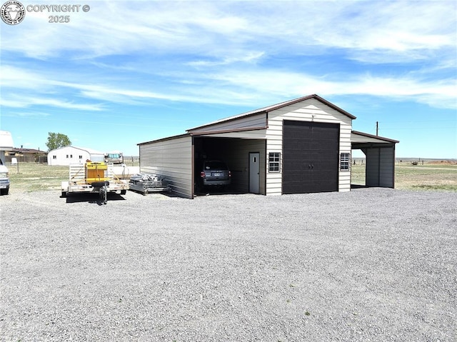 view of outbuilding with an outdoor structure and driveway