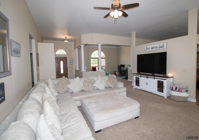 living room featuring decorative columns, ceiling fan, and carpet