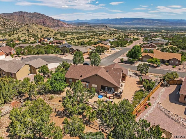 birds eye view of property featuring a mountain view