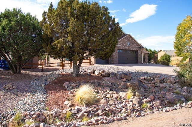 obstructed view of property featuring a garage