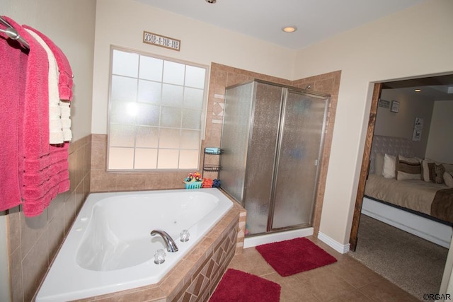 bathroom with tile patterned flooring and independent shower and bath