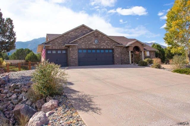 view of front of home featuring a garage and a mountain view