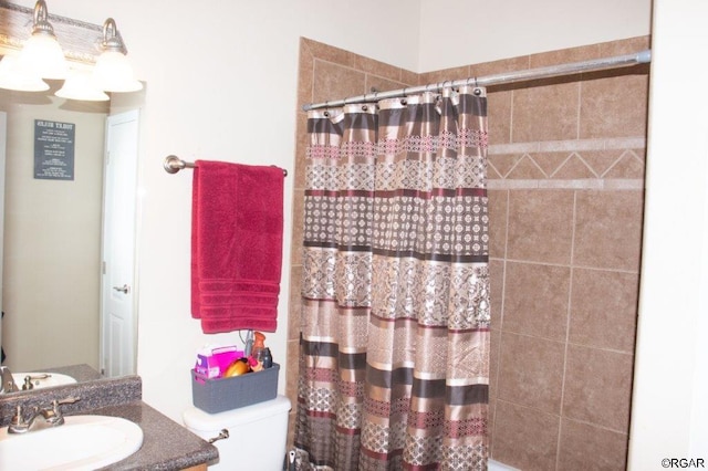 bathroom featuring vanity and toilet