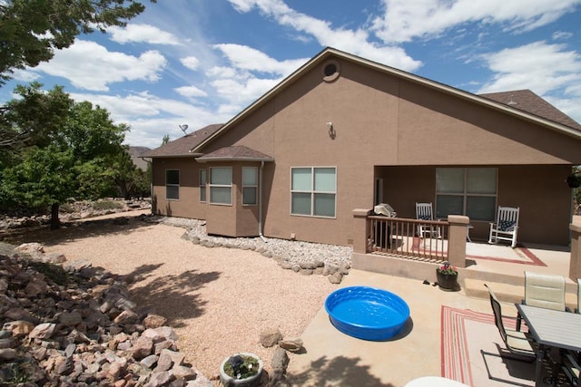 back of property with a patio area