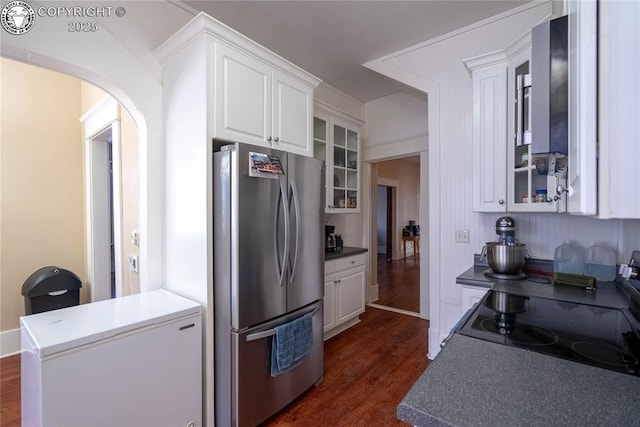 kitchen featuring white cabinetry, electric range, stainless steel refrigerator, and refrigerator