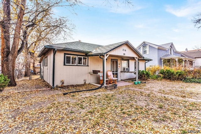 bungalow-style home with cooling unit