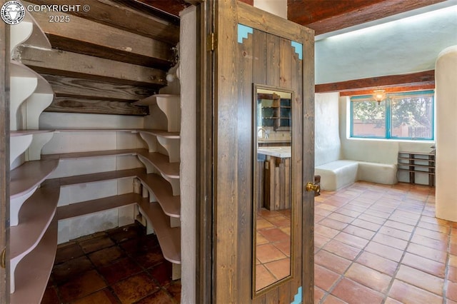 stairs with tile patterned floors