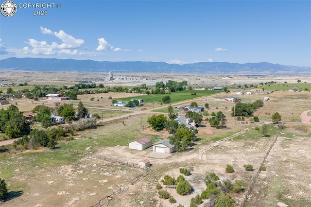 aerial view with a mountain view and a rural view