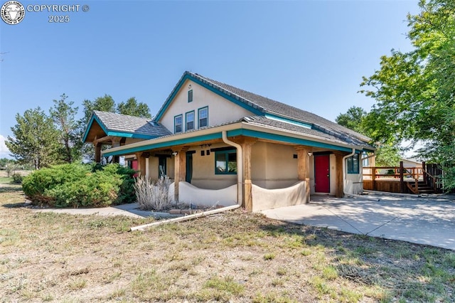 view of front of home featuring a patio area and stucco siding