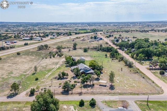 birds eye view of property featuring a rural view