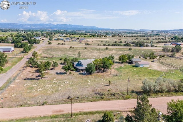 birds eye view of property with a rural view and a mountain view