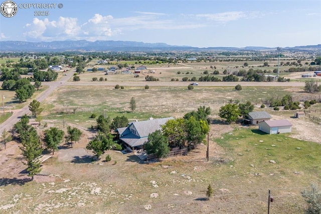 birds eye view of property featuring a rural view and a mountain view