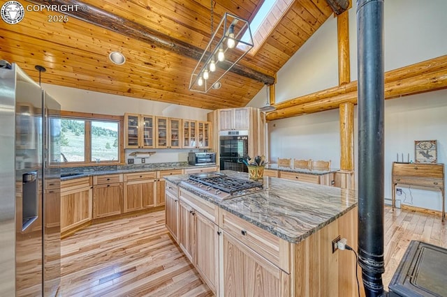 kitchen featuring light wood finished floors, glass insert cabinets, a center island, wood ceiling, and appliances with stainless steel finishes