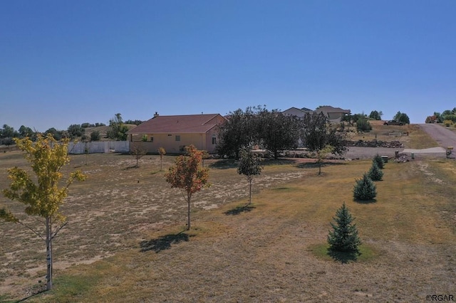 view of yard with a rural view