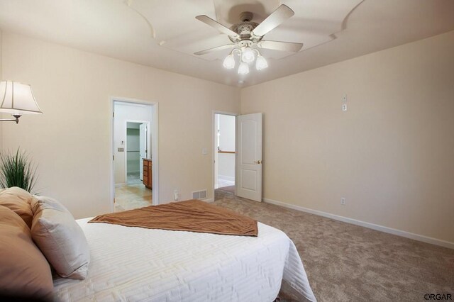 carpeted bedroom featuring ceiling fan