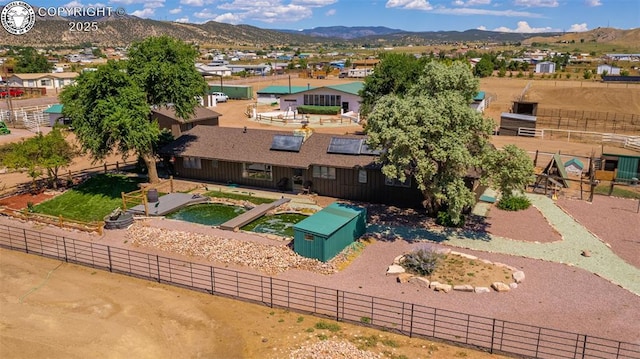 birds eye view of property with a mountain view