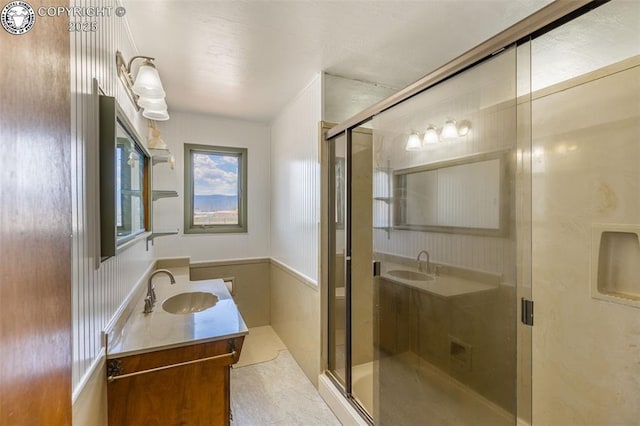 bathroom with an enclosed shower and vanity