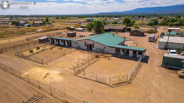 birds eye view of property featuring a mountain view