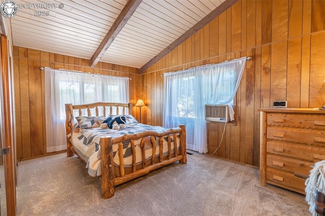 bedroom featuring vaulted ceiling with beams, carpet flooring, and wood walls